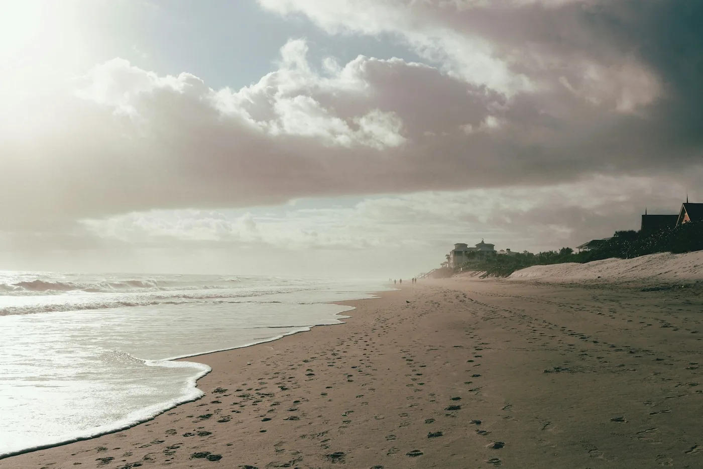 Waves washing onto a sandy Florida shoreline; contextual photograph, not a photograph of Beach week weather: sunny and breezy all week