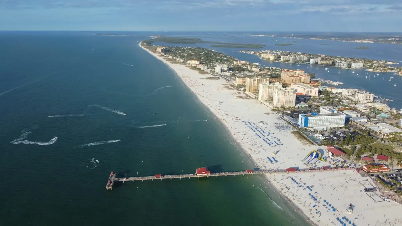 Aerial view of Clearwater Beach, hotels, and a pier; contextual photograph, not a photograph of frenchys clearwater beach