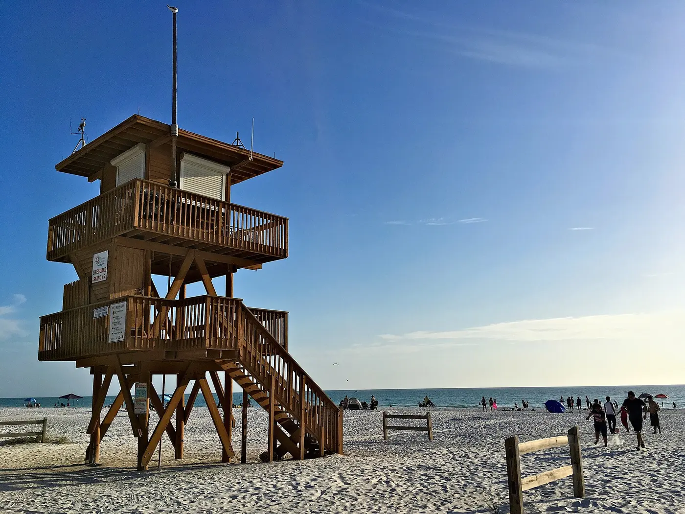 A wooden lifeguard tower on the sand at Coquina Beach on Anna Maria Island