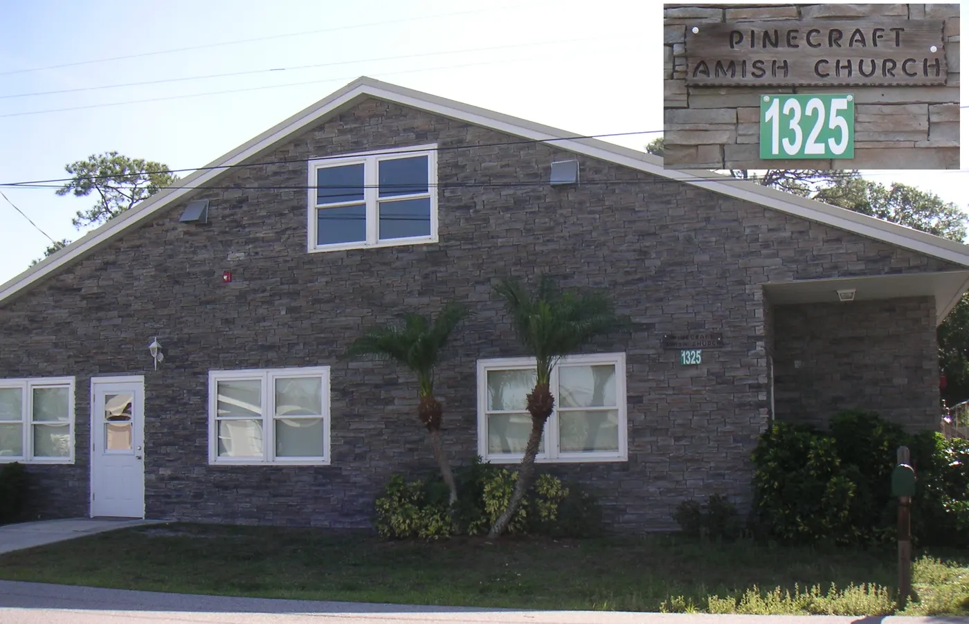 The stone-faced Pinecraft Amish Church building at 1325 Hines Street, with a sign reading 'Pinecraft Amish Church 1325' on the corner
