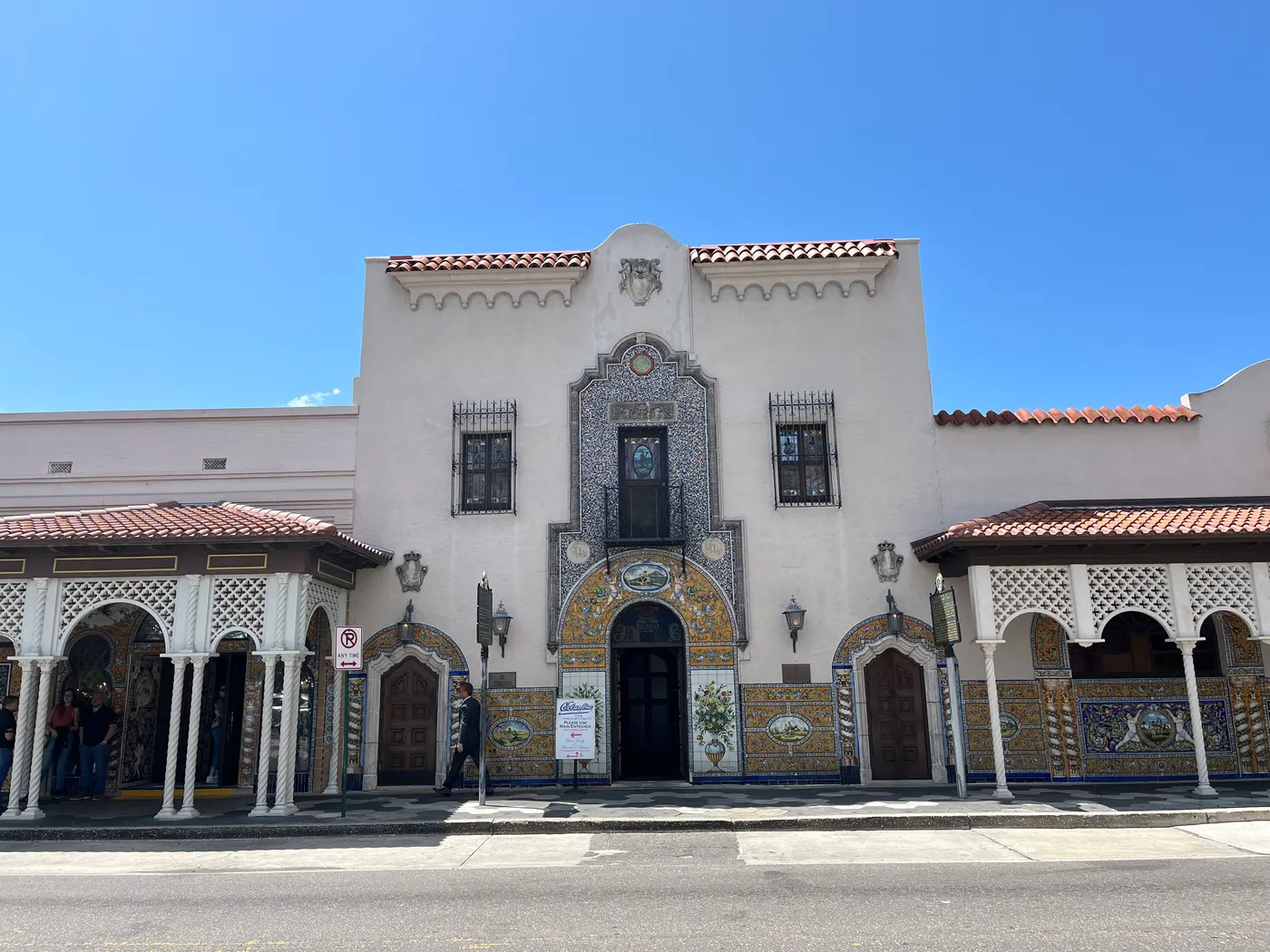 The ornate Spanish Revival facade of the Columbia Restaurant in Ybor City, with tiled arches and wrought-iron balconies