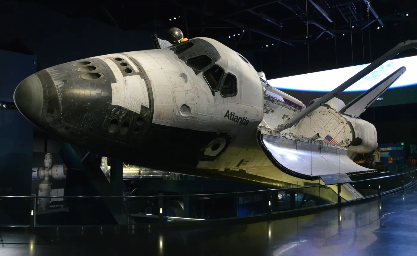 Space Shuttle Atlantis displayed nose-first at an angle inside the Kennedy Space Center Visitor Complex