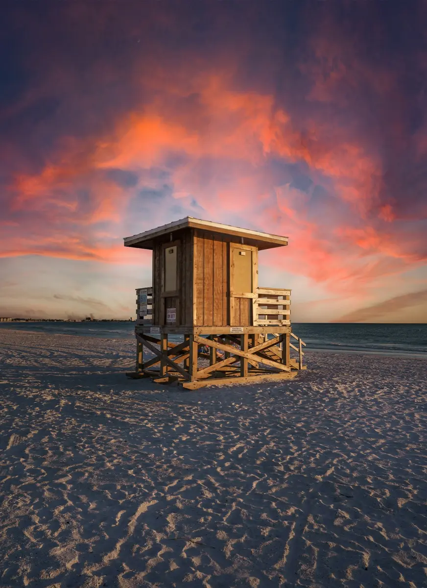 Wooden lifeguard tower on a Sarasota beach at sunset